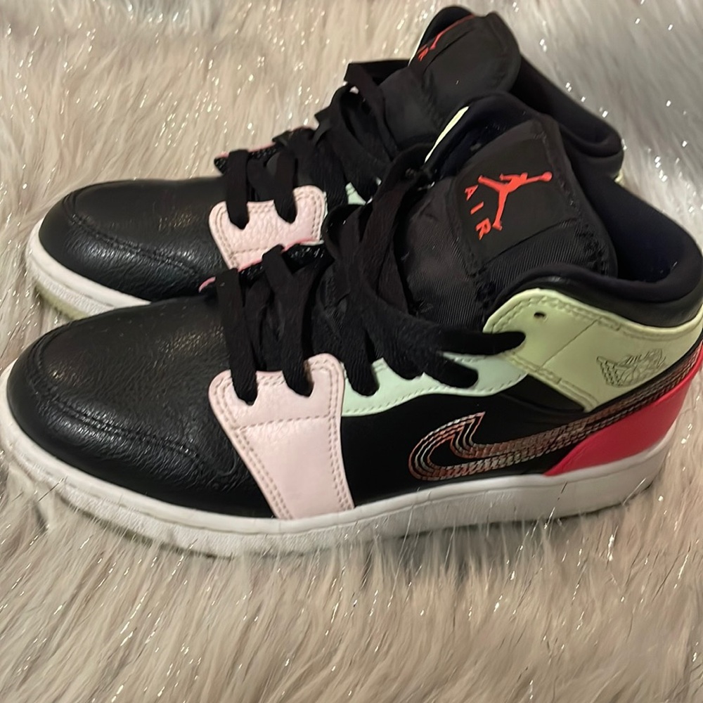 Black & white colorful Jordan 1s glow on the dark sole